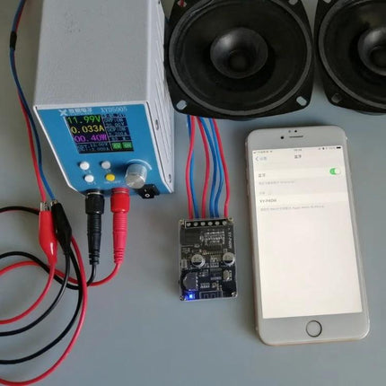 Bluetooth Stereo Amplifier for Home Audio Systems, 40W Output showing Bluetooth module connected to speakers and smartphone for streaming