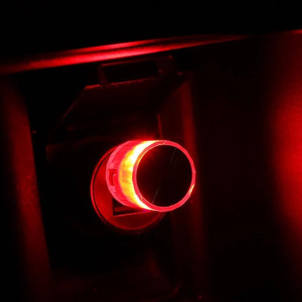 Car USB LED Atmosphere Lamp Multicolor Mood Lighting - red USB plug-in mood light glowing in car footwell, compact 3×1.8cm plug-and-play ambient lamp