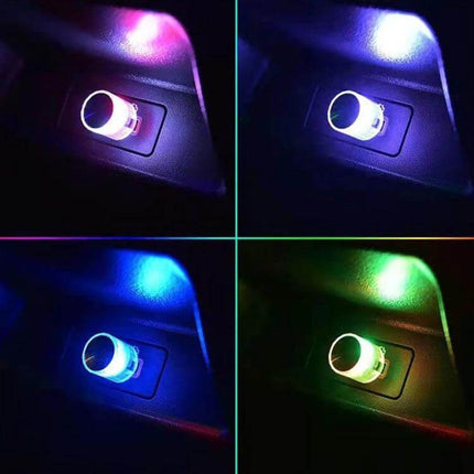Car USB LED Atmosphere Lamp Multicolor Mood Lighting — compact USB plug-in interior ambient light showing purple, blue, green and white glow in car footwell
