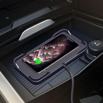 POLMXS Car Anti Slip Wireless Charger For Qi Phones shown in car console charging a smartphone with anti-slip pad and cable