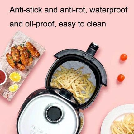 Oil Absorbing Air Fryer Paper 23cm Square For Easy Cleanup shown lining air fryer with fries to prevent oil splatter and simplify cleanup