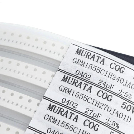 0402 SMD Capacitor Sample Book for Electronic Projects and Testing showing Murata 0402 capacitor reels and labeled parts for prototyping and testing