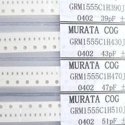0402 SMD Capacitor Sample Book for Electronic Projects and Testing — compact Murata 0402 tape reels and labeled capacitor values for prototyping