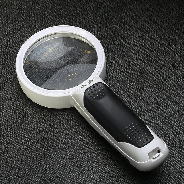 Hand-Held LED Magnifier for Reading and Repair, 10x Magnification - white handheld magnifier with LED and ergonomic black grip