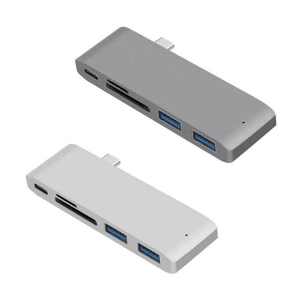 USB-C Multi-Port Docking Station with HDMI and Card Reader shown in gray and silver, with dual USB-A, HDMI, and SD/microSD slots for travel and remote work