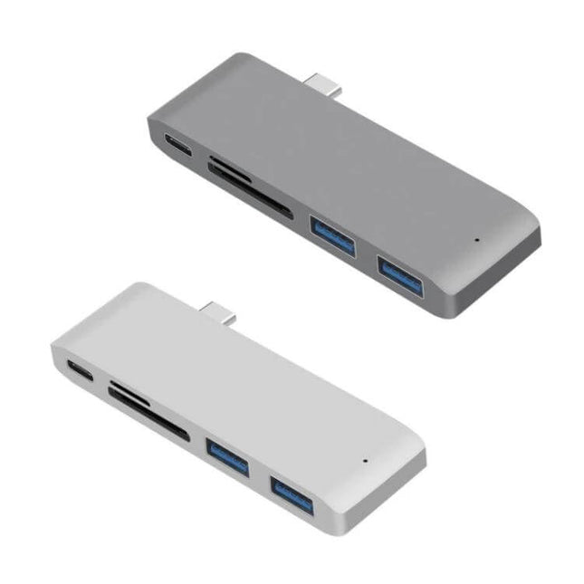 USB-C Multi-Port Docking Station with HDMI and Card Reader shown in gray and silver, with dual USB-A, HDMI, and SD/microSD slots for travel and remote work
