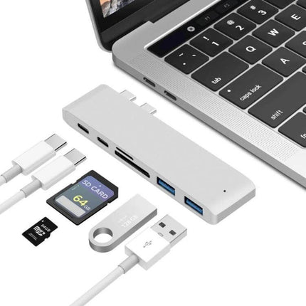 USB-C Multi-Port Docking Station with HDMI and Card Reader connected to laptop with SD card, USB drive and cables