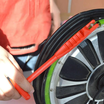 Practical Tool for Everyday Car Tire Valve Maintenance - red valve removal tool extracting valve from car tire rim