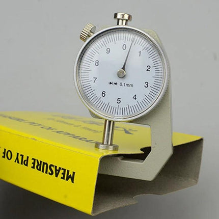 Dial Thickness Gauge for Leather, Paper, and Metal, 0-10mm dial gauge measuring paper and leather thickness with clear analog dial