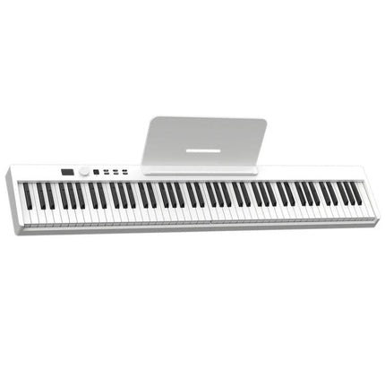 Compact Folding Electric Piano for Everyday Music Practice at Home - slim white folding keyboard on desk with music stand