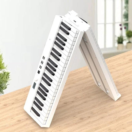 Compact Folding Electric Piano for Everyday Music Practice at Home - white foldable keyboard set up on desk for small spaces