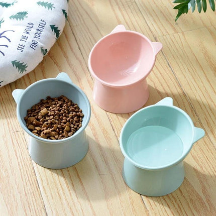 Practical Elevated Cat Food Bowl for Daily Home Use - pastel pink and blue elevated PP feeding bowls on wooden floor
