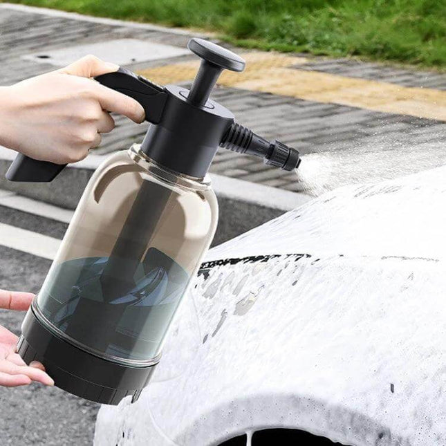 Handheld Foam Sprayer for Car Washing and Home Cleaning applying dense foam to a car hood for efficient cleaning