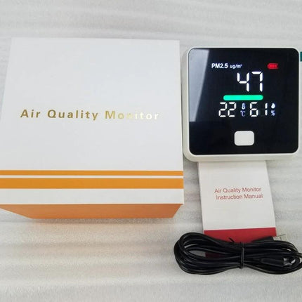Compact Air Quality Monitor for Indoor Temperature and Humidity Detection showing PM2.5 47, temp 22°C and 61% humidity with box and cable