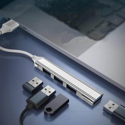 Compact 4-in-1 USB-C Docking Station for Multiple Device Connections - slim USB hub connected to laptop with multiple USB devices