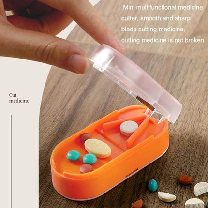 Home Transparent Tablet Divider Medicine Box With Compartments showing open orange pill box with built-in cutter and compartments for sorted tablets