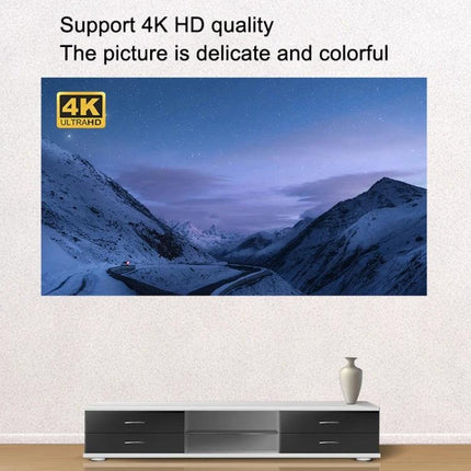 Portable Folding Projection Screen for Home Use displaying 4K Ultra HD mountain scene above a modern TV console, easy wall setup
