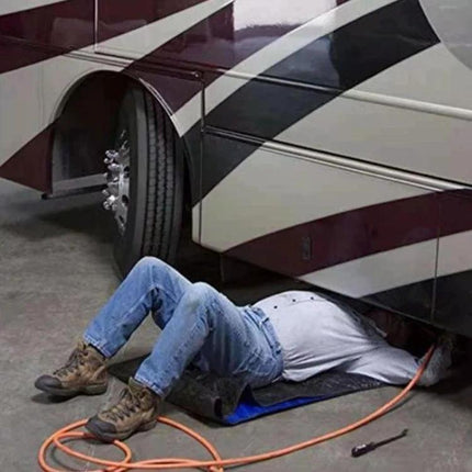 A foldable pad for quick vehicle fixes during travel placed under an RV passenger repairing undercarriage to stay clean and stable