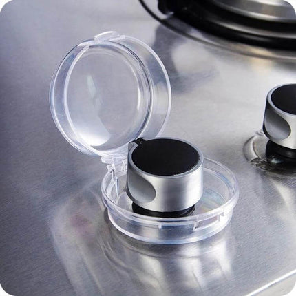 Gas Stove Switch Protective Cover Transparent 6cm Diameter shown installed on stainless stove knob, heat‑resistant splash and oil barrier