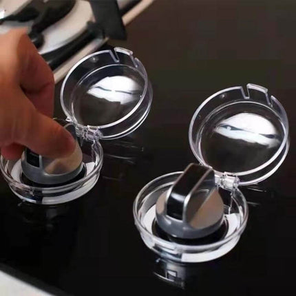 Gas Stove Switch Protective Cover Transparent 6cm Diameter on stovetop showing clear heat‑resistant guard shielding knobs from steam and oil
