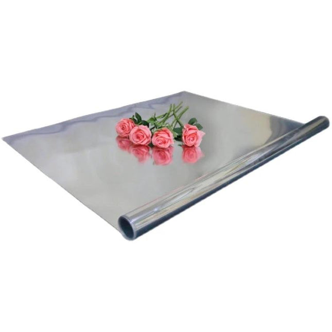 Wrinkled Reflective Tin Foil Paper for Photography Backgrounds showing rolled reflective sheet with pink roses and subtle wrinkle reflections