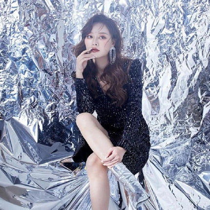 Wrinkled Reflective Tin Foil Paper for Photography Backgrounds used as textured silver backdrop behind model in black sequin dress