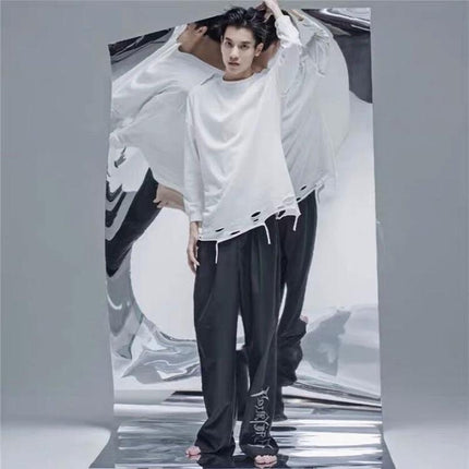 Wrinkled Reflective Tin Foil Paper for Photography Backgrounds showing male model with dynamic wrinkle reflections and textured silver backdrop