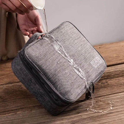 Multifunctional 5-Inch Storage Bag for Cables and Electronics showing water-resistant grey travel organizer with zippers and elastic bands