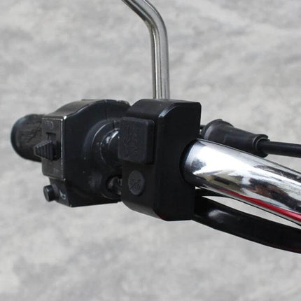Motorcycle Dual USB Charger Black For Daily Phone Use On The Road mounted on chrome handlebar with waterproof silicone cover and dual USB ports