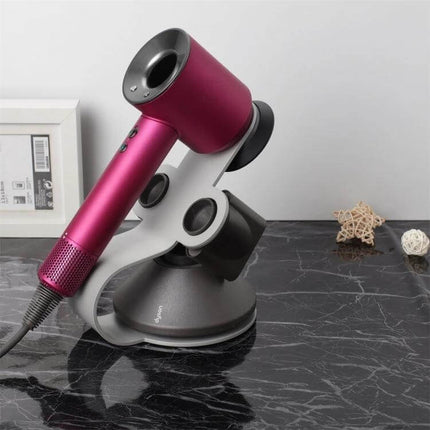 Punch Free Standing Hair Dryer Stand For Dyson Silver on marble salon station holding pink Dyson hair dryer, mild steel polished finish