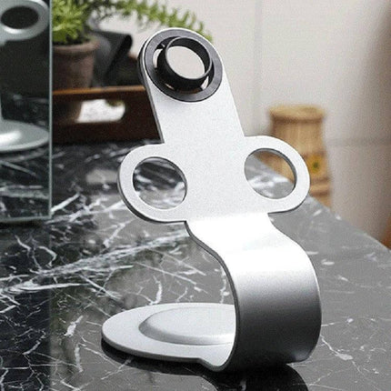 Punch Free Standing Hair Dryer Stand For Dyson Silver on marble salon counter, polished mild steel hands-free holder for Dyson dryer