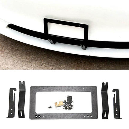 Punch-Free Front License Plate Holder for Tesla Model 3 and Y mounted on white bumper with bracket and hardware laid out