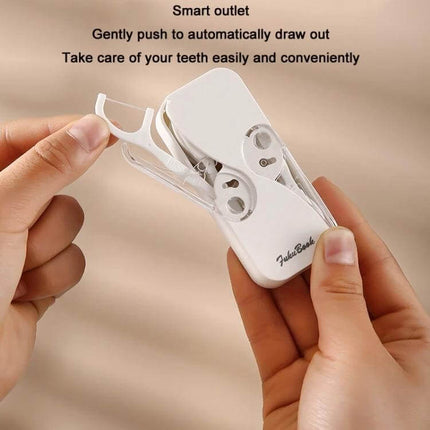 FukuBook Portable Mini Floss Box With Auto Opening And Closing For Daily Use - compact white TPR+ABS automatic floss dispenser held in hand