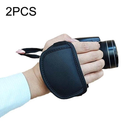 Comfortable DSLR Camera Wrist Strap for Daily Use in black PU leather on hand holding compact camera