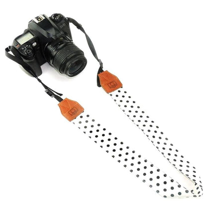 Retro Style Camera Shoulder Strap for Everyday Use white polka dot strap with faux leather accents attached to DSLR camera