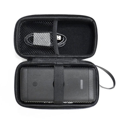 Marshall Emberton Compact Carry Bag For Travel And Daily Commute showing speaker secured with strap and cable in mesh pocket