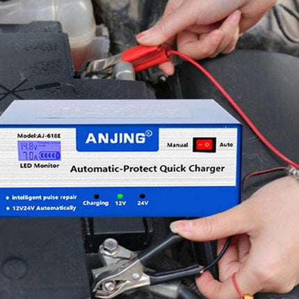 ANJING Battery Charger For Lead-Acid Car Batteries With EU US UK Plugs connected to car battery showing clamps and LED display