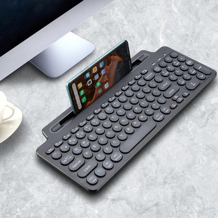 Wireless Bluetooth Keyboard with Integrated Bracket for Everyday Typing compact gray keyboard with built-in touchpad and phone slot