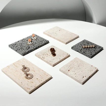 Set of Cave Stone Jewelry Display Stands for Photography showing six natural stone platforms with earrings arranged for product photos