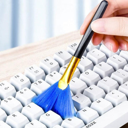Crevice Cleaning Brush Set for Keyboards and Electronic Devices - blue bristle brush cleaning dust from white keyboard keys