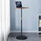 SSKY Adjustable Height Laptop Stand for Standing Workspaces shown in a minimal room with laptop on height-adjustable platform promoting better posture