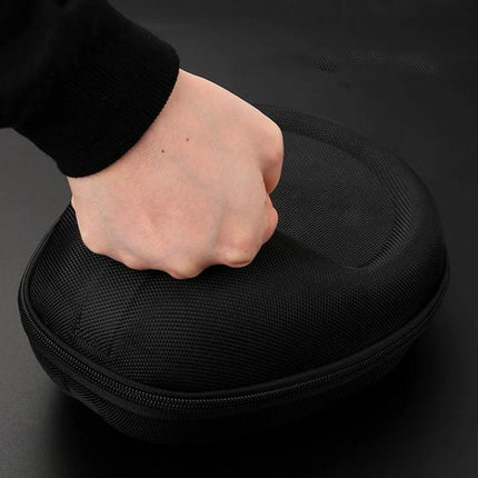 Compact Headphone Carrying Pouch With Organizer Pocket For Commuting showing hand pressing black shell case