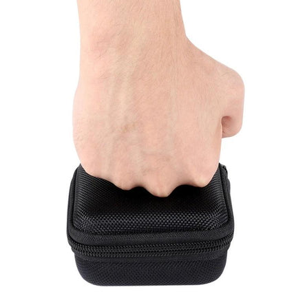Hard Shell Bag for Storing Powerbeats Pro Headphones on the Go - compact black EVA case being held by hand, protects earbuds during travel