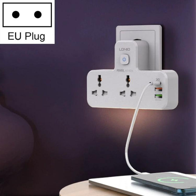 LDNIO Multifunctional Home Charging Socket with Night Light plugged into EU wall, three outlets and USB ports illuminating bedside area