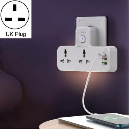 LDNIO Multifunctional Home Charging Socket with Night Light plugged into UK wall, three outlets and USB ports with soft night light