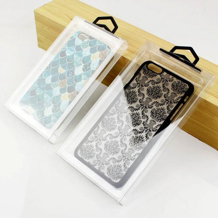 Transparent PVC Phone Case Packaging Box for 4.7 Inch Devices, Pack of 50 showing two clear PVC boxes with decorative phone cases visible