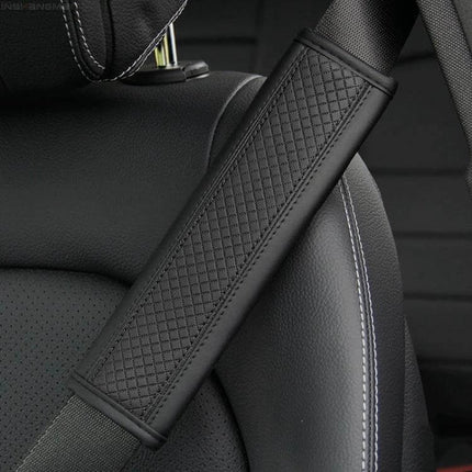 Fiber Leather Embossed Car Seat Belt Shoulder Cover 23x6.5 cm on black car seat showing quilted PU leather pad reducing shoulder pressure