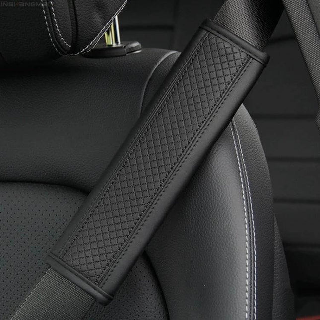 Fiber Leather Embossed Car Seat Belt Shoulder Cover 23x6.5 cm on black car seat showing quilted PU leather pad reducing shoulder pressure