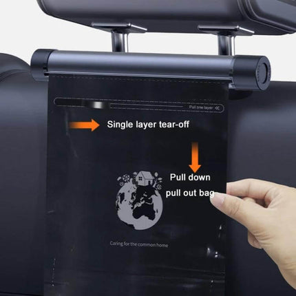 Car Mounted Trash Bag Holder And Organiser, Titanium Grey mounted on headrest showing single-layer tear-off waterproof bag being pulled down