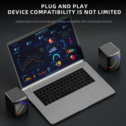 Dark Alien Compact USB Desktop Stereo Speakers Dark Finish next to laptop, compact wired USB speakers with metal net